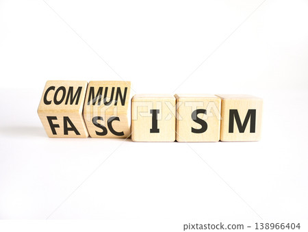 Communism or fascism symbol. Concept words Fascism to Communism on beautiful wooden cubes. Beautiful white table white background. Business historical and communism or fascism concept. Copy space. Communism or fascism symbol. Concept words Fascism to Communism on beautiful wooden cubes. Beautiful white table white background. Business historical and communism or fascism concept. Copy space. 138966404