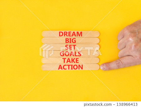 Dream big take action words symbol. Concept words Dream big Set goals Take action on beautiful wooden sticks. Beautiful yellow background. Business Dream big Set goals Take action concept. Copy space. Dream big take action words symbol. Concept words Dream big Set goals Take action on beautiful wooden sticks. Beautiful yellow background. Business Dream big Set goals Take action concept. Copy space. 138966413
