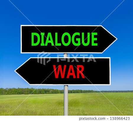 Dialogue instead war symbol. Concept words Dialogue and War on beautiful black road sign. Beautiful blue sky green grass background. Social and dialogue instead war concept. Copy space. Dialogue instead war symbol. Concept words Dialogue and War on beautiful black road sign. Beautiful blue sky green grass background. Social and dialogue instead war concept. Copy space. 138966423