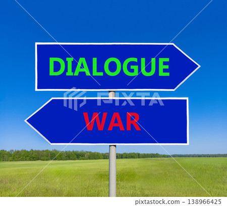 Dialogue instead war symbol. Concept words Dialogue and War on beautiful blue road sign. Beautiful blue sky green grass background. Social and dialogue instead war concept. Copy space. 138966425