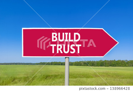 Build trust symbol. Concept words Build trust on beautiful red road sign. Beautiful blue sky green grass field background. Business and build trust concept, copy space. Build trust symbol. Concept words Build trust on beautiful red road sign. Beautiful blue sky green grass field background. Business and build trust concept, copy space. 138966428