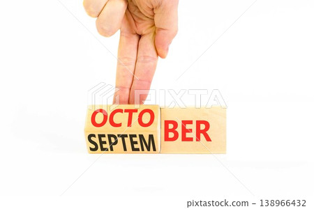Symbol for the change from September to October. Concept words October to November on beautiful wooden blocks. Beautiful white background. Businessman's hand. Happy October concept. Copy space. Symbol for the change from September to October. Concept words October to November on beautiful wooden blocks. Beautiful white background. Businessman's hand. Happy October concept. Copy space. 138966432