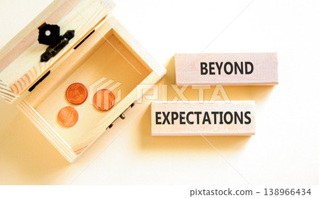 Beyond expectations words symbol. Concept words Beyond expectations on beautiful blocks. Beautiful white background. Wooden chest with coins. Business and Beyond expectations words concept. Copy space 138966434