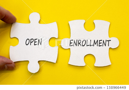 Open enrollment words symbol. Concept words Open enrollment on beautiful white puzzles. Beautiful yellow background. Doctor hand. Medical and Open enrollment words concept. Copy space. 138966449