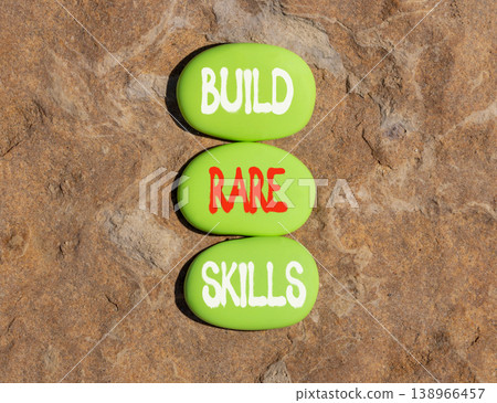 Build rare skills words symbol. Concept words Build rare skills on beautiful green stones. Beautiful stone beach background. Business and build rare skills concept. Copy space. 138966457