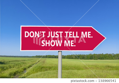 Tell or show symbol. Concept words Do not just tell me, show me beautiful red road sign. Beautiful blue sky green field background. Business tell or show concept. Copy space. 138966541