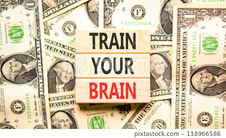 Train your brain words symbol. Concept words Train your brain on beautiful wooden blocks. Beautiful dollar bills background. Dollar bills. Business motivational and train your brain concept Copy space Train your brain words symbol. Concept words Train your brain on beautiful wooden blocks. Beautiful dollar bills background. Dollar bills. Business motivational and train your brain concept Copy space 138966586