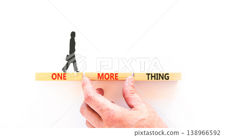 One more thing words symbol. Concept words One more thing on beautiful wooden blocks. Beautiful white background. Businessman hand. Business and one more thing concept. Copy space. One more thing words symbol. Concept words One more thing on beautiful wooden blocks. Beautiful white background. Businessman hand. Business and one more thing concept. Copy space. 138966592
