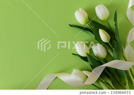White Tulips with Ribbon on Green Spring Background White Tulips with Ribbon on Green Spring Background 138966653
