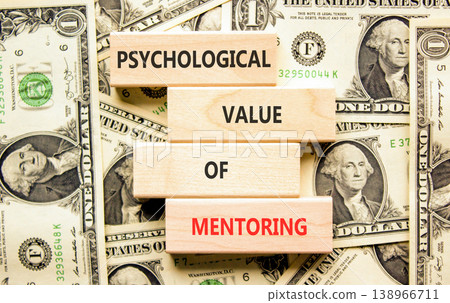 Value of mentoring symbol. Concept words Psychological value of mentoring on beautiful wooden blocks. Beautiful dollar bills background. Business psychological value of mentoring concept. Copy space. Value of mentoring symbol. Concept words Psychological value of mentoring on beautiful wooden blocks. Beautiful dollar bills background. Business psychological value of mentoring concept. Copy space. 138966711