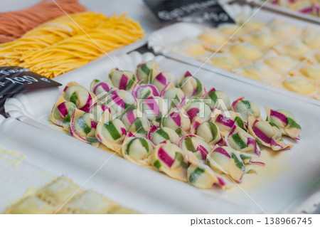 Raw homemade Italian ravioli pasta with meat and cheese on counter - close up 138966745
