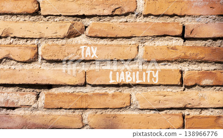 Tax liability words symbol. Concept words Tax liability on beautiful brick wall. Beautiful brick wall background. Business and Tax liability words concept. Copy space. Tax liability words symbol. Concept words Tax liability on beautiful brick wall. Beautiful brick wall background. Business and Tax liability words concept. Copy space. 138966776