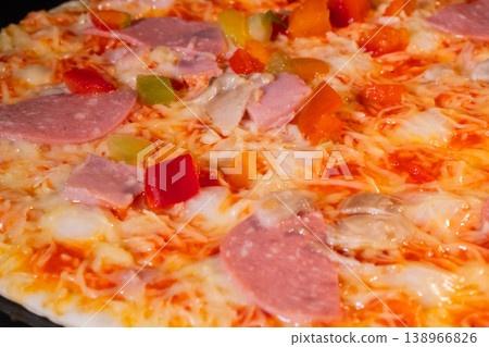Homemade pizza baking on tray in electric oven: close up 138966826