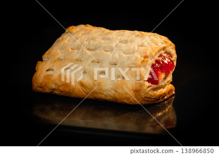 Bun with red strawberry jam baking in electric oven: close up Bun with red strawberry jam baking in electric oven: close up 138966850