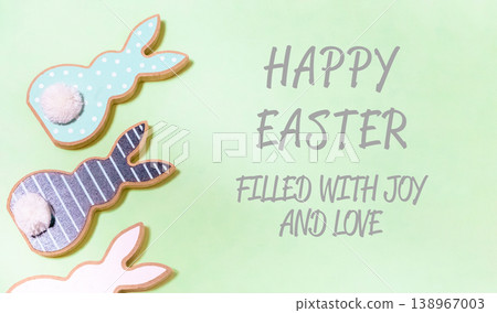 Green background with three Easter bunny cookies on it Green background with three Easter bunny cookies on it 138967003