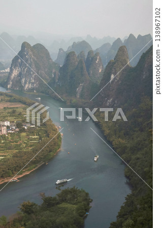 Karst mountains and the Li River in Guilin, China. Vertical view. Karst mountains and the Li River in Guilin, China. Vertical view. 138967102