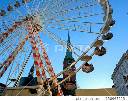 Ferris wheel in city with church and blue sky Ferris wheel in city with church and blue sky 138967213