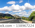 Sunny Sicilian road with mountains and trees 138967224