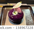 Luxury lilac pastry with cream and flower decoration. 138967228