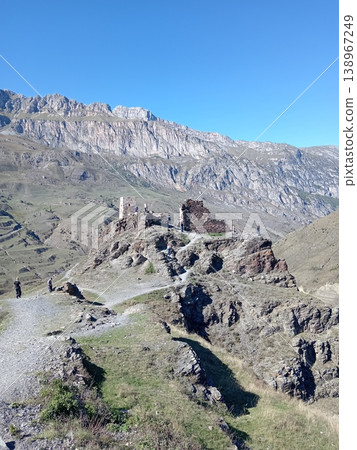 Signal tower ruins of Kurta and Taga, North Ossetia, Russia. Remains of a medieval stone tower with panoramic views of the surrounding Caucasus landscape Signal tower ruins of Kurta and Taga, North Ossetia, Russia. Remains of a medieval stone tower with panoramic views of the surrounding Caucasus landscape 138967249