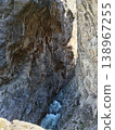 Bright summer day at a mountain river in a stone crevice, North Ossetia, Russia. Water stream cutting through a deep rocky gap in the Caucasus landscape 138967255