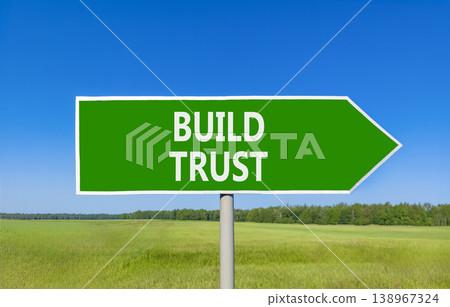 Build trust symbol. Concept words Build trust on beautiful green road sign. Beautiful blue sky green grass field background. Business and build trust concept, copy space. Build trust symbol. Concept words Build trust on beautiful green road sign. Beautiful blue sky green grass field background. Business and build trust concept, copy space. 138967324
