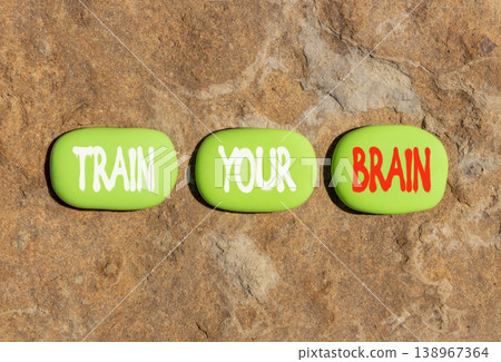 Train your brain words symbol. Concept words Train your brain on beautiful green stones. Beautiful stone beach background. Business motivational and train your brain concept. Copy space. Train your brain words symbol. Concept words Train your brain on beautiful green stones. Beautiful stone beach background. Business motivational and train your brain concept. Copy space. 138967364