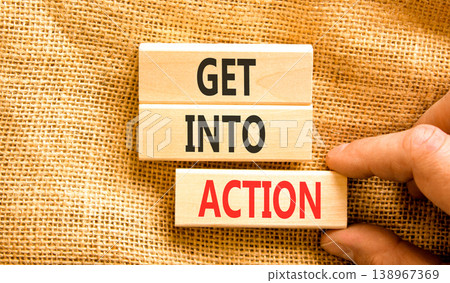Get into action words symbol. Concept words Get into action on beautiful wooden blocks. Beautiful canvas background. Businessman hand. Business and Get into action concept. Copy space. Get into action words symbol. Concept words Get into action on beautiful wooden blocks. Beautiful canvas background. Businessman hand. Business and Get into action concept. Copy space. 138967369