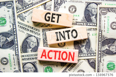 Get into action words symbol. Concept words Get into action on beautiful wooden blocks. Beautiful dollar bills background. Dollar bills. Business and Get into action concept. Copy space. Get into action words symbol. Concept words Get into action on beautiful wooden blocks. Beautiful dollar bills background. Dollar bills. Business and Get into action concept. Copy space. 138967376