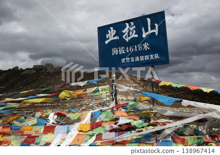 A landscape of prayer flags (tarcho) spread across a mountain pass in the highlands. 138967414