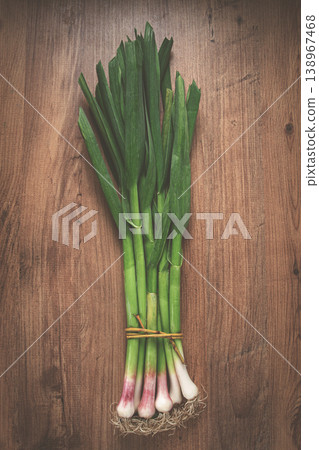 a bunch of young, green garlic, on a wooden table, top view, no people, a bunch of young, green garlic, on a wooden table, top view, no people, 138967468