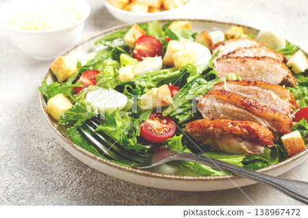 Caesar salad, with duck breast, on a light plate, on a light background, homemade, no people, Caesar salad, with duck breast, on a light plate, on a light background, homemade, no people, 138967472