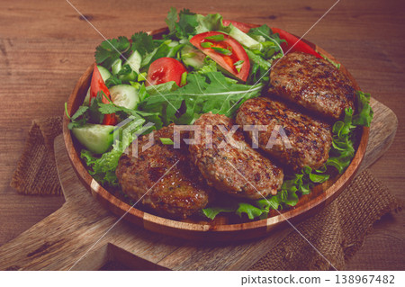 Fried cutlets, mixed minced meat, with vegetable salad, homemade, top view, no people, Fried cutlets, mixed minced meat, with vegetable salad, homemade, top view, no people, 138967482