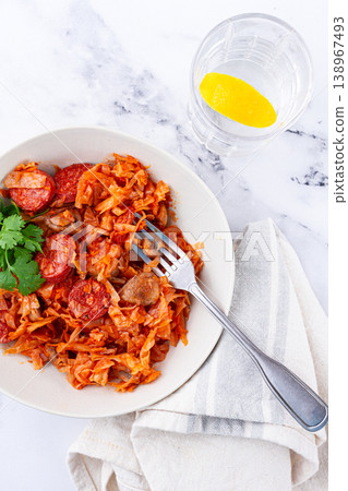 Bigos, Polish dish bigos, on a marble table, stewed meat with cabbage, chorizo sausages, mushrooms, homemade, without people, Bigos, Polish dish bigos, on a marble table, stewed meat with cabbage, chorizo sausages, mushrooms, homemade, without people, 138967493