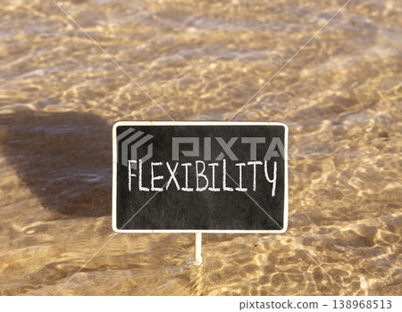Flexibility symbol. Concept word Flexibility on beautiful black blackboard. Beautiful Red sea water background. Business flexibility concept. Copy space. Flexibility symbol. Concept word Flexibility on beautiful black blackboard. Beautiful Red sea water background. Business flexibility concept. Copy space. 138968513