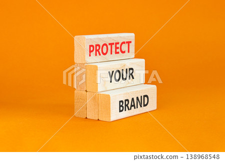 Protect your brand words symbol. Concept words Protect your brand on beautiful wooden blocks. Beautiful orange background. Business and protect your brand concept. Copy space. Protect your brand words symbol. Concept words Protect your brand on beautiful wooden blocks. Beautiful orange background. Business and protect your brand concept. Copy space. 138968548