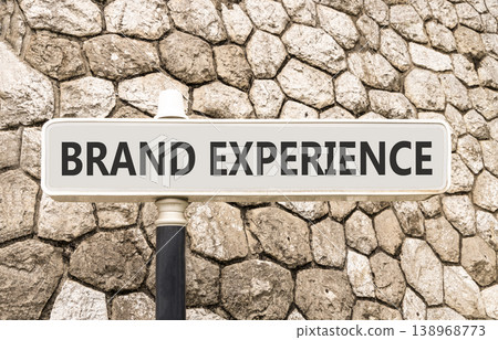 Brand experience symbol. Concept words Brand experience on beautiful big white road sign. Beautiful grey stone wall background. Business branding and brand experience concept. Copy space. Brand experience symbol. Concept words Brand experience on beautiful big white road sign. Beautiful grey stone wall background. Business branding and brand experience concept. Copy space. 138968773