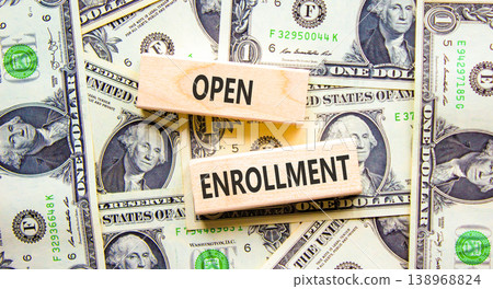 Open enrollment words symbol. Concept words Open enrollment on beautiful wooden blocks. Beautiful dollar bills background. Dollar bills. Medical and Open enrollment words concept. Copy space. 138968824
