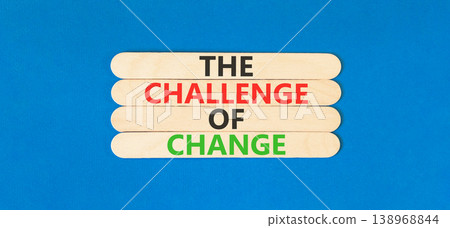 The challenge of change words symbol. Concept words The challenge of change on beautiful wooden sticks. Beautiful blue background. Business the challenge of change concept. Copy space. The challenge of change words symbol. Concept words The challenge of change on beautiful wooden sticks. Beautiful blue background. Business the challenge of change concept. Copy space. 138968844