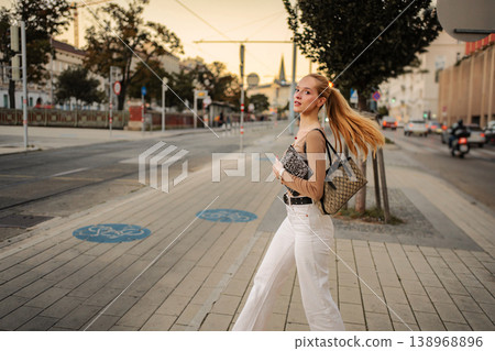 Young woman walking across street in Vienna Austria Young woman walking across street in Vienna Austria 138968896