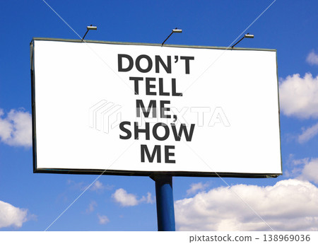 Tell or show symbol. Concept words Do not tell me, show me on beautiful white billboard. Beautiful blue sky background. Business tell or show concept. Copy space. Tell or show symbol. Concept words Do not tell me, show me on beautiful white billboard. Beautiful blue sky background. Business tell or show concept. Copy space. 138969036