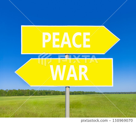 Peace instead war symbol. Concept words Peace and War on beautiful yellow road sign. Beautiful blue sky green grass background. Social and peace instead war concept. Copy space. Peace instead war symbol. Concept words Peace and War on beautiful yellow road sign. Beautiful blue sky green grass background. Social and peace instead war concept. Copy space. 138969070