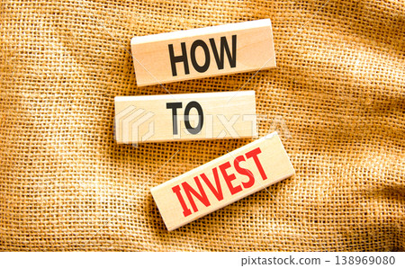 How to invest words symbol. Concept words How to invest on beautiful wooden blocks. Beautiful canvas background. Business and how to invest concept. Copy space. 138969080