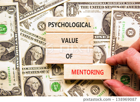 Value of mentoring symbol. Concept words Psychological value of mentoring on beautiful wooden blocks. Beautiful dollar bills background. Business psychological value of mentoring concept. Copy space. Value of mentoring symbol. Concept words Psychological value of mentoring on beautiful wooden blocks. Beautiful dollar bills background. Business psychological value of mentoring concept. Copy space. 138969087
