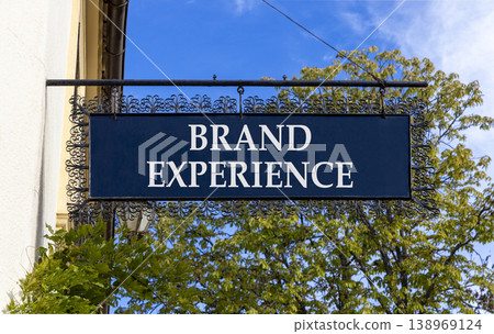 Brand experience symbol. Concept words Brand experience on beautiful big black road sign. Beautiful blue sky green trees background. Business branding and brand experience concept. Copy space. 138969124