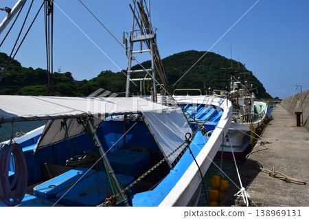 Fishing boat anchored at the fishing port Fishing boat anchored at the fishing port 138969131