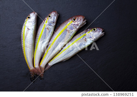 Mediterranean Red Mullet Fish on Granite Background Mediterranean Red Mullet Fish on Granite Background 138969251