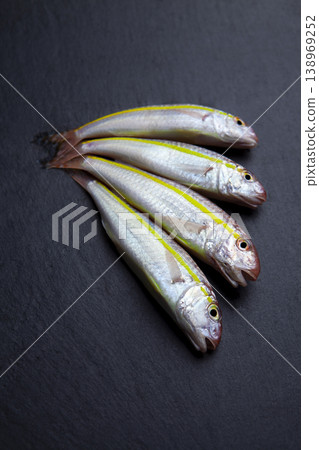 Mediterranean Red Mullet Fish on Granite Background Mediterranean Red Mullet Fish on Granite Background 138969252