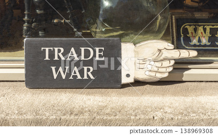 Trade war symbol. Concept word Trade war on beautiful black wooden hand with finger. Beautiful shop display background. Business trade war concept. Copy space. Trade war symbol. Concept word Trade war on beautiful black wooden hand with finger. Beautiful shop display background. Business trade war concept. Copy space. 138969308