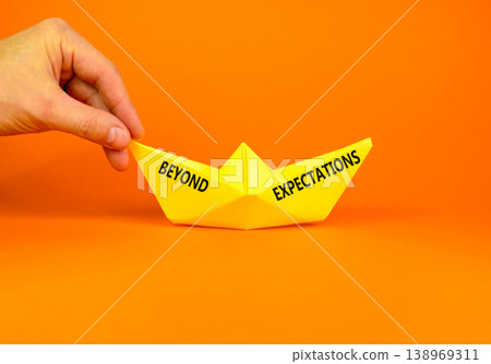 Beyond expectations words symbol. Concept words Beyond expectations on beautiful yellow paper boat. Beautiful orange background. Business and Beyond expectations words concept. Copy space. Beyond expectations words symbol. Concept words Beyond expectations on beautiful yellow paper boat. Beautiful orange background. Business and Beyond expectations words concept. Copy space. 138969311